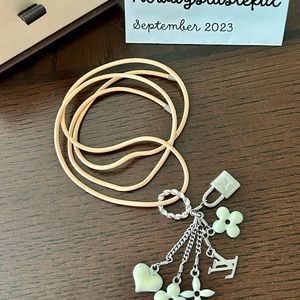 Louis Vuitton Pendant Sweet Mono Blanc (M62485)